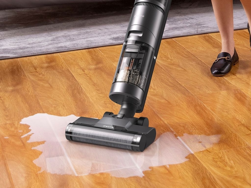 The Difference Between Wet and Dry Vacuum Cleaners User cleaning living room carpet with a dry vacuum cleaner Lagos Nigeria