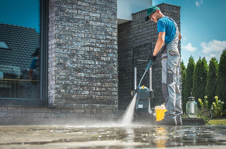 What PSI & GPM Mean in Pressure Washers (And Why It Matters) Industrial pressure washer removing grime from a concrete factory floor with high PSI and GPM Lagos Nigeria