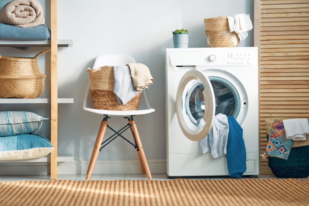 How to Make Your Washing Machine Last Longer: Maintenance Tips Affordable Top load washing machine in Lagos with clothes neatly arranged for laundry